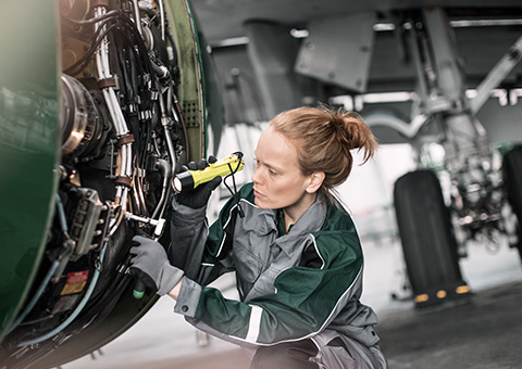 Engineer inspecting an installed rolling bearing system (photo)